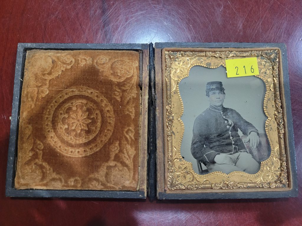 Here is the second yellow "price tag" type sticker on the copper frame and ambrotype itself.