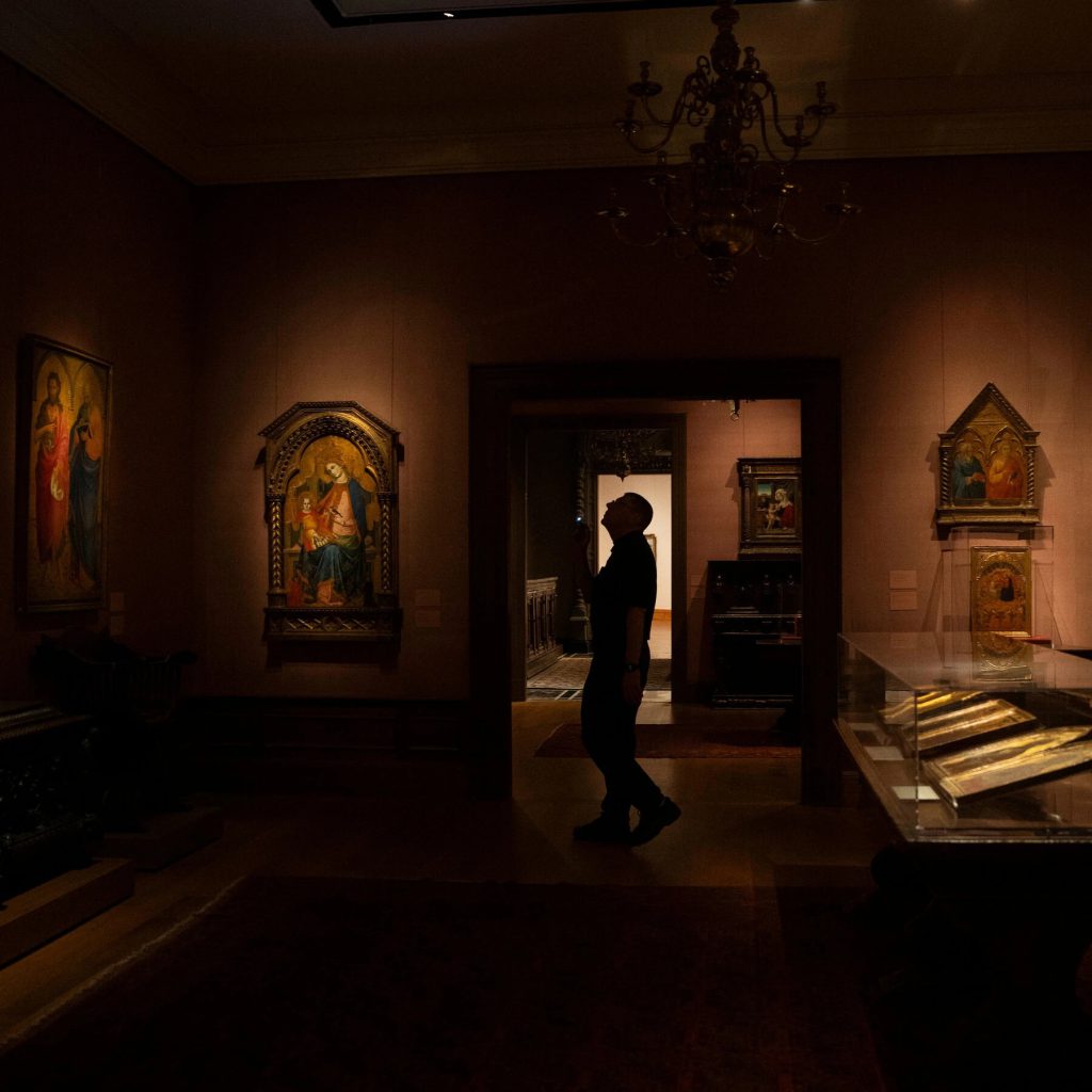 Here is an example of an exhibit gallery using very low lighting. This is at the Met and you can see how the artifacts are in nearly total darkness and lit only dimly. This is helping to preserve the colors and overall condition of the works while still allowing visitors to see them. Often these galleries have motion sensors and the lights do not turn on until someone walks in.